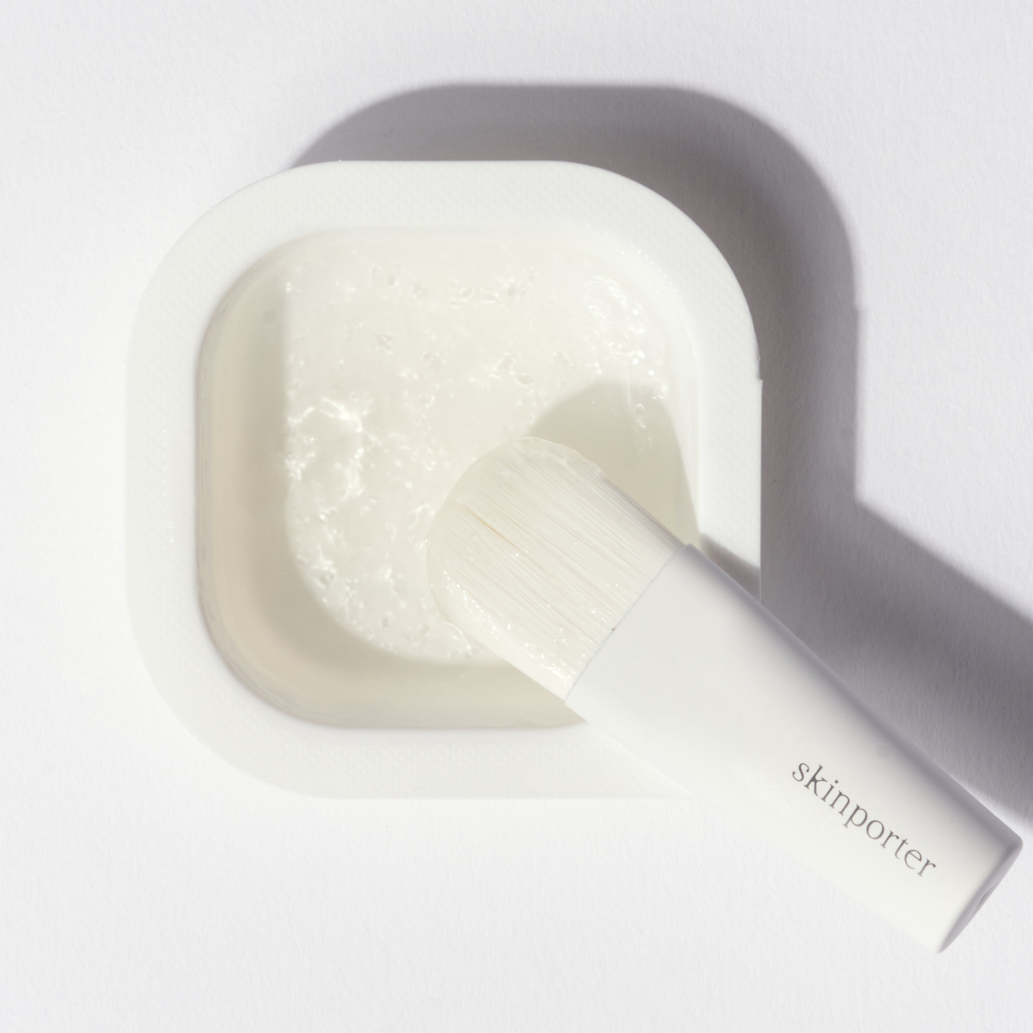 SKINPORTER O₂ Peptide Facial in travel packaging with a sleek design and clear labeling.